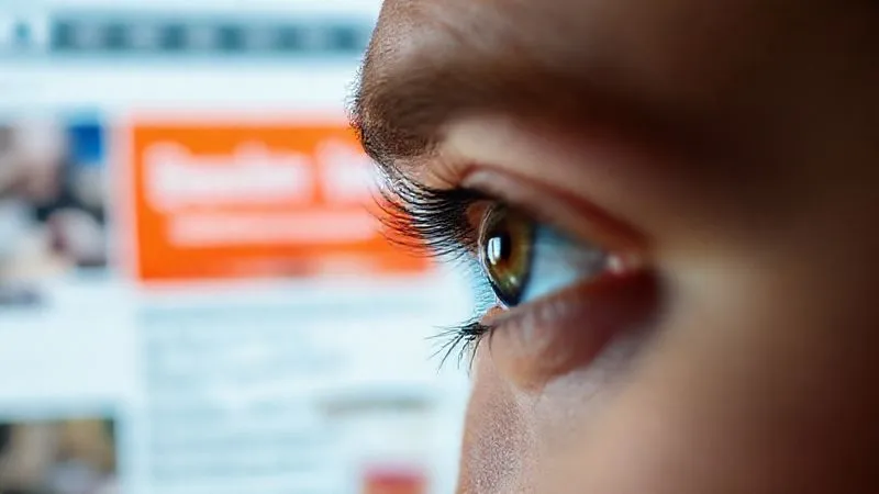 A photorealistic image showing a person's eyes quickly scanning a cluttered webpage, with a blurred, unengaging banner in the background, representing "banner blindness." Sharp focus on the eye movement, cinematic lighting, 8K, shot on a high-end DSLR.